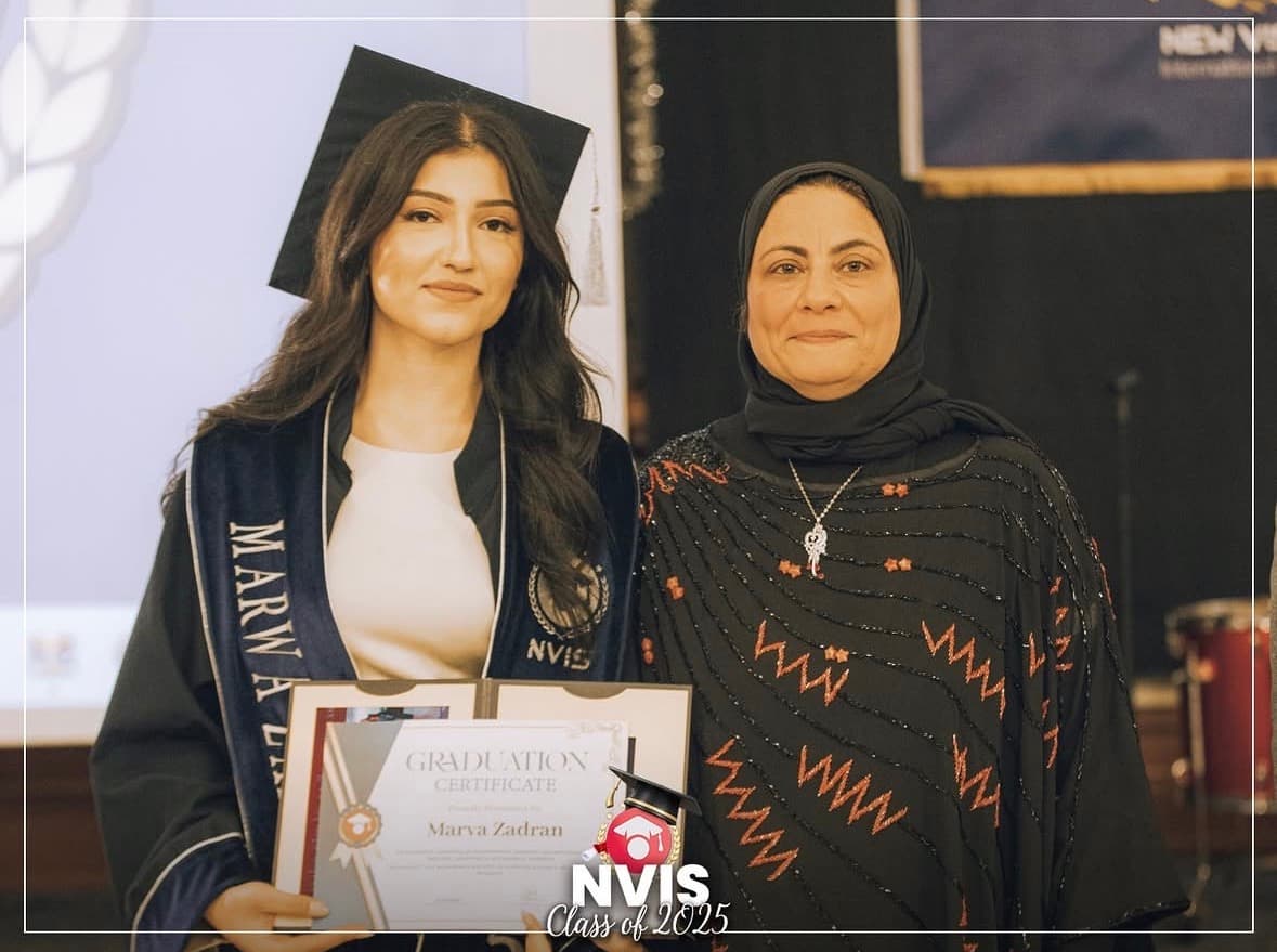 An NVIS graduate receiving her diploma at the Class of 2025 ceremony