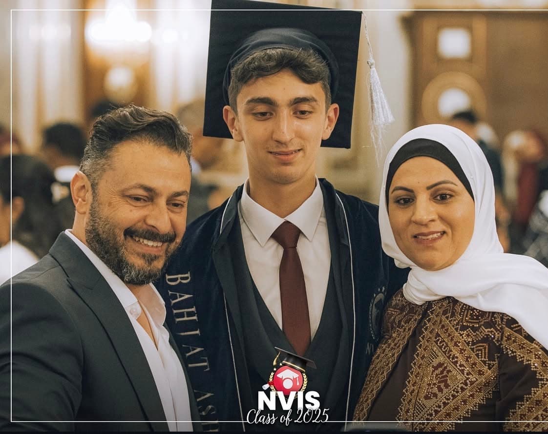 An NVIS graduate celebrating with family at the Class of 2025 ceremony